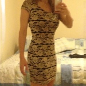 Tan and black sexy lacy dress with cut out back Size medium.